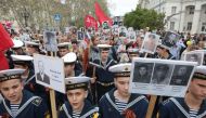 Navy cadets carry portraits of World War Two soldiers during the Immortal Regiment march as they celebrate the 72nd anniversary of the Soviet Union's victory over Nazi Germany in WWII in Sevastopol, Crimea, on May 9, 2017. / AFP / Max Vetrov