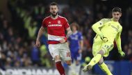 Chelsea's Belgian goalkeeper Thibaut Courtois (R) passes the ball by Middlesbrough's Spanish striker Alvaro Negredo during the English Premier League football match between Chelsea and Middlesbrough at Stamford Bridge in London on May 8, 2017.   AFP / Adr