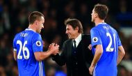 Chelsea manager Antonio Conte celebrates after the English Premier League match against Middlesbrough with John Terry and Nemanja Matic at Stamford Bridge yesterday.