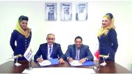 Ahmed Janahi (second left), Gulf Air Chief Commercial Officer,  and Noel Swain (second right), Chief Operating Officer of Ezeego1.com, during the signing ceremony. 