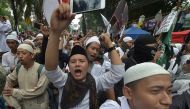 Indonesian protesters chant slogans against Jakarta governor Basuki Tjahaja Purnama following his trial on May 9, 2017. / AFP.