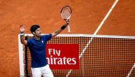 Serbian tennis player Novak Djokovic celebrates his victory over Spanish tennis player Nicolas Almagro during the ATP Madrid Open in Madrid, on May 10, 2017. Djokovic won 6-1, 4-6 and 7-5. / AFP / OSCAR DEL POZO
