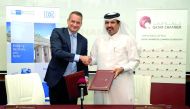 Mohammad bin Ahmed bin Towar Al Kuwari, Vice-Chairman of Qatar Chamber (right) exchanging documents with Felix Neugart, at the signing ceremony. Pic: Abdul Basit/The Peninsula