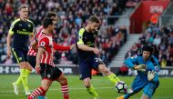 Arsenal's Shkodran Mustafi and Petr Cech in action with Southampton's Cedric Soares and Manolo Gabbiadini. Reuters / Andrew Couldridge 
