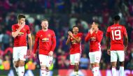 From left: Manchester United midfielder Michael Carrick, striker Wayne Rooney, midfielder Jesse Lingard, defender Chris Smalling and striker Marcus Rashford celebrate their win on the pitch after the UEFA Europa League semi-final, second-leg football matc