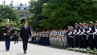 French President Emmanuel Macron reviews troops as he attends a flag ceremony in the garden of the Elysee Palace after his inauguration in Paris, France, May 14, 2017. REUTERS/Gonzalo Fuentes.