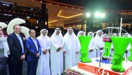 Commercial Bank Chairman, Sheikh Abdullah bin Ali bin Jabor Al Thani (fourth left), Vice- Chairman Hussain Ibrahim Al Fardan (fifth left), and other officials at the opening ceremony of Commercial Bank's new branch at the Mall of Qatar, yesterday. Pic: Ka