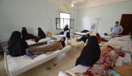 Women sit with relatives infected with cholera at a hospital in the Red Sea port city of Hodeidah, Yemen May 14, 2017. REUTERS/Abduljabbar Zeyad

