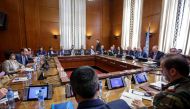 Syria's main opposition High Negotiations Committee (HNC) leader Naser al-Hariri and UN Special Envoy of the Secretary-General for Syria Staffan de Mistura attend a round of negotiation, during the Intra Syria talks, at the European headquarters of the Un