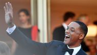 US actor and member of the Feature Film jury Will Smith waves as he arrives on May 17, 2017 for the screening of the film 'Ismael's Ghosts' (Les Fantomes d'Ismael) during the opening ceremony of the 70th edition of the Cannes Film Festival in Cannes, sout