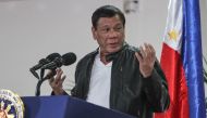 Philippine President Rodrigo Duterte gestures as he speaks shortly after arriving in Davao on May 16, 2017, from a working visit to China. AFP / MANMAN DEJETO
