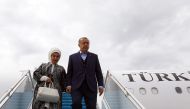 President of Turkey Recep Tayyip Erdogan (R) and his wife Emine Erdogan (L) leave the private plane called 