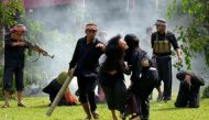 Cambodian fine arts school students take part in a performance to mark the annual 'Day of Anger' at the Choeung Ek killing fields memorial in Phnom Penh on May 18, 2017. PHOTO: AFP