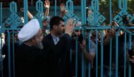 Iran's President Hassan Rouhani waves to supporters at a polling station during the presidential election in Tehran, Iran, May 19, 2017. President.ir/Handout via REUTERS
