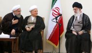 File photo of Iran's supreme leader Ayatollah Ali Khamenei, right, speaking with President Hassan Rouhani, left, and former president Akbar Hashemi Rafsanjani, centre, during an Assembly of Experts meeting (AFP) 