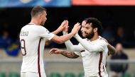 AS Roma's Egyptian midfielder Mohamed Salah (R) celebrates with AS Roma's Belgium midfielder Radja Nainggolan and Roma's forward from Bosnia-Herzegovina Edin Dzeko (L) after scoring during the Italian Serie A football match Chievo vs AS Roma at the Marcan