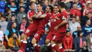 Liverpool's Brazilian midfielder Philippe Coutinho (L) celebrates scoring his team's second goal during the English Premier League football match between Liverpool and Middlesbrough at Anfield in Liverpool, north west England on May 21, 2017.  AFP / Paul 