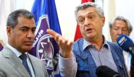 The United Nations' High Commissioner for Refugees (UNHCR) Filippo Grandi (R) speaks during a press conference at the Tripoli branch of the Illegal Immigration Authority, next to its director Colonel Mohammed Beshr, in the Libyan capital on May 21, 2017. 