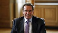(FILES) This file photo taken on April 28, 2017 shows US former California state senator and president of the Regions of Climate Action (R20) non-profit organisation, Arnold Schwarzenegger meeting with the Mayor of Paris in Paris to sign a convention for 
