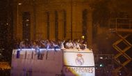Real Madrid players celebrate atop their bus as it arrives to Cibeles square after Real Madrid won the La Liga title. Reuters/Paul Hanna