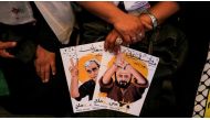 A woman holds posters of Palestinian prisoners who are held in Israeli jails, during a demonstration in support of the Palestinian prisoners, outside the International Committee of the Red Cross (ICRC) in Gaza City, Gaza on May 22, 2017. ( Mustafa Hassona