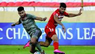 Lekhwiya's Ahmed Yasser (left) vies for the ball possession against Persepolis' Mehdi Taremi during their AFC Champions League  match played at the Azadi Stadium in Tehran yesterday.