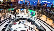 People walk through the Mall of Berlin shopping centre in Berlin, September 24, 2014