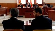 (FILES) This file photo taken on June 2, 2016 shows Barcelona's football star Lionel Messi (R) and his father Jorge Horacio Messi facing judges in a tax fraud case at the courthouse of Barcelona. AFP / POOL / Alberto Estevez
