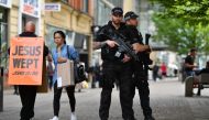 Armed police stand secure a street in central Manchester, northwest England, on May 24, 2017, following the May 22 terror attack at the Manchester Arena. AFP / Ben Stansall