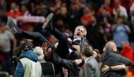 Manchester United's Portuguese manager Jose Mourinho is thrown in the air by his staff after the UEFA Europa League final football match Ajax Amsterdam v Manchester United on May 24, 2017 at the Friends Arena in Solna outside Stockholm. / AFP / Odd ANDERS