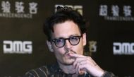 Actor Johnny Depp gestures during a promotional event of his new movie ''Transcendence'', on his first visit to China in Beijing, March 31, 2014. REUTERS
