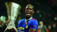 Manchester United's French midfielder Paul Pogba celebrates with the trophy after winning the UEFA Europa League final on Wednesday.