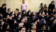 Relatives of killed Coptic Christians grieve as they gather during the funeral at Abu Garnous Cathedral in the north Minya town of Maghagha, on May 26, 2017. AFP / MOHAMED EL-SHAHED