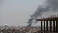Smoke rises after clashes between National Reconciliation Government of Libya and National Liberation Government in Tripoli, Libya on May 26, 2017. ( Stringer - Anadolu Agency )
