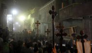 Mourners carry crosses and march after the funeral of Coptic Christians who were killed on Friday in Minya, Egypt, May 26, 2017. REUTERS/Mohamed Abd El Ghany
