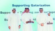 Qatargas CEO, Khalid bin Khalifa Al Thani (second left) after receiving the Qatarisation Award from H E Dr Mohammed bin Saleh Al Sada (third left), Minister of Energy and Industry, in the presence of Saad Sherida Al Kaabi (left), QP President and CEO and 