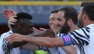 Juventus' forward from Italy Moise Kean (L) celebrates with teammate Juventus' defender from Switzerland Stephan Lichtsteiner, Juventus' forward from Argentina Gonzalo Higuain (C) and Juventus' defender from Italy Andrea Barzagli (R) after scoring during 