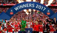 Arsenal's players celebrate after their win over Chelsea on the pitch after the English FA Cup final football match between Arsenal and Chelsea at Wembley stadium in London on May 27, 2017.  AFP / Ian KINGTON 