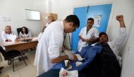 A Tunisian patient receives treatment at the emergency room of the Charles Nicole Hospital in Tunis on May 5, 2017. AFP / FETHI BELAID