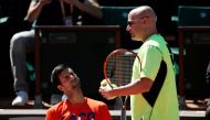 Novak Djokovic of Serbia and his coach Andre Agassi attend a training session. (REUTERS/Benoit Tessier)
