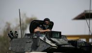 A member of the Iraqi Federal Police is seen on an armoured vehicle at the frontline in western Mosul, Iraq May 29, 2017. REUTERS/Alkis Konstantinidis
