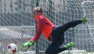 Barcelona's goalkeeper Marc-Andre ter Stegen blocks a ball during a training session. REUTERS/Albert Gea
