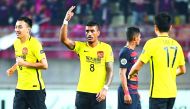 Guangzhou Evergrande's midfielder Paulinho celebrates his goal during the AFC Champions League match against Kashima Antlers in Kashima, Ibaraki prefecture yesterday. 