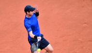 Andy Murray of Great Britain returns to Andrey Kuznetsov of Russia in their first round match of the French Open at the Roland Garros Stadium in Paris, France yesterday. Murray won 6-4, 4-6, 6-2, 6-0.