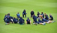 England's captain Eoin Morgan (top row 2L) holds a team talk ahead of their nets practice session at The Oval in London on May 31, 2017, on the eve of their ICC Champions Trophy cricket match against Bangladesh. (AFP / GLYN KIRK)