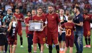 Francesco Totti (C) holds a plaquet as he poses for a photo with Daniele De Rossi (16) of A.S. Roma ahead of the Serie A Week 38 match between A.S. Roma and Genoa CFC at Stadio Olimpico in Rome, Italy on May 28, 2017.  Claudio Pasquazi - AA
