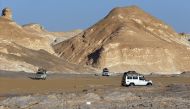 FILE PHOTO: Four-wheel drive cars cross the Egyptian western desert and the Bahariya Oasis, southwest of Cairo in this picture taken May 15, 2015. REUTERS/Amr Abdallah Dalsh