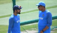 (FILES) This file photo taken on March 24, 2017 shows India's cricket coach Anil Kumble (R) talking with captain Virat Kohli during a training session on the eve of a Test match between India and Australia at the Himachal Pradesh Cricket Association Stadi