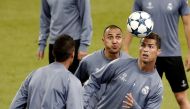 Cristiano Ronaldo (R) and Keylor Navas (C) of Real Madrid attend a training session ahead of the UEFA Champions League final football match between Juventus and Real Madrid at the National Stadium of Wales on June 3, in Cardiff, Wales on June 02, 2017. ( 