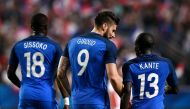 (From L) France's midfielder Moussa Sissoko, France's forward Olivier Giroud and France's midfielder N'Golo Kante react at the end of the friendly football match France vs Paraguay on June 2, 2017 at the Roazhon Park stadium in Rennes. France won 5-0. / A